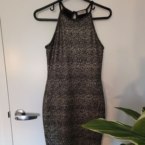 Gold and black sleeveless bodycon dress.